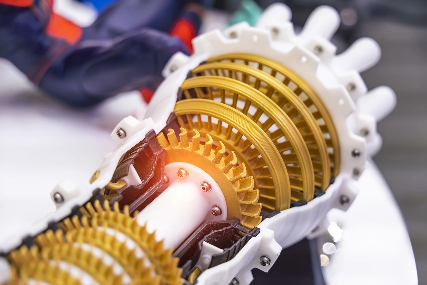 Close-up of a cutaway mechanical assembly with yellow gears.